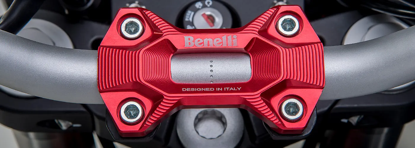 Machined red Benelli handlebar clamp