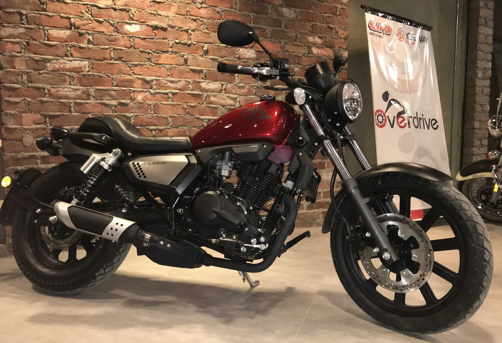 Red version on display against a brick wall